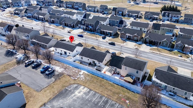 birds eye view of property with a residential view