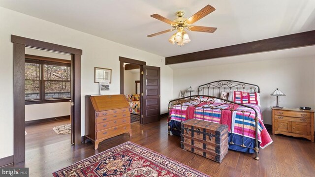 bedroom featuring beamed ceiling, ceiling fan, and dark hardwood / wood-style floors