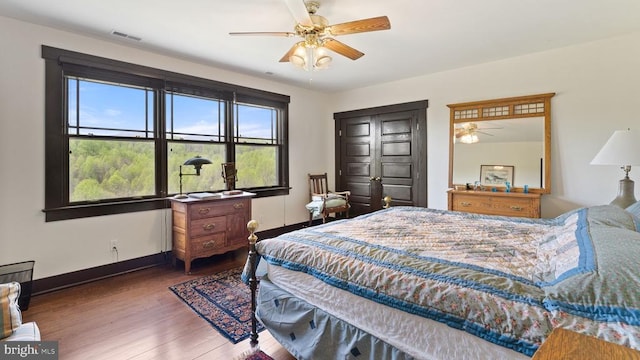 bedroom featuring hardwood / wood-style flooring and ceiling fan