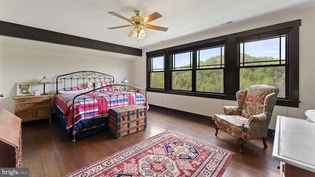 bedroom with ceiling fan and dark hardwood / wood-style floors