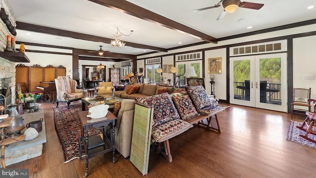 interior space featuring french doors, beam ceiling, access to exterior, a fireplace, and hardwood / wood-style floors