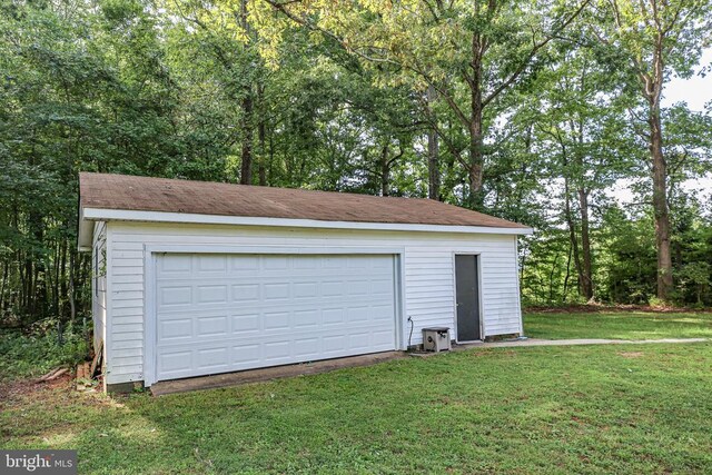 garage with a yard