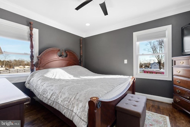 bedroom featuring ornamental molding, ceiling fan, and dark hardwood / wood-style flooring