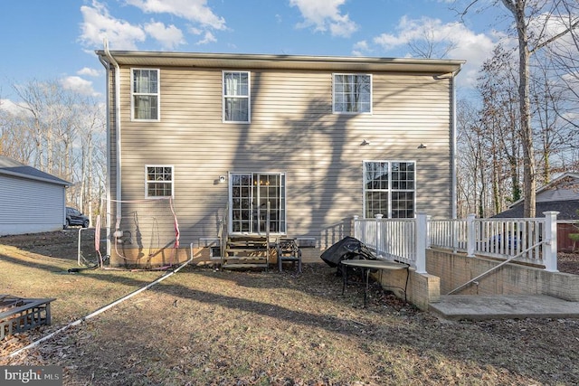 rear view of property featuring entry steps