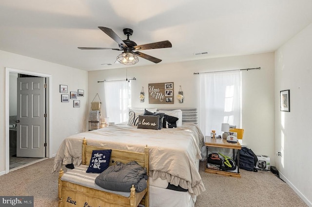 bedroom with carpet floors, visible vents, ceiling fan, and baseboards