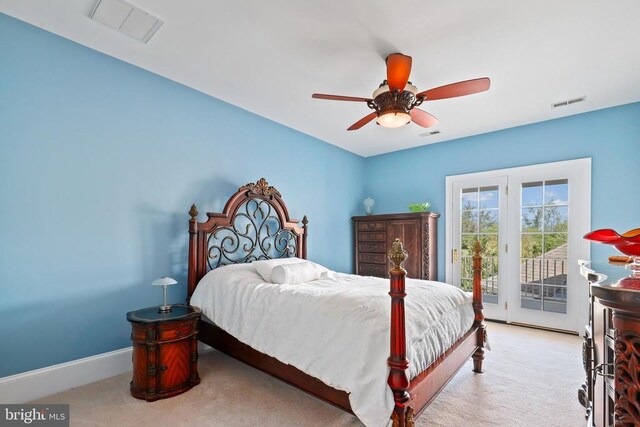 bedroom with light carpet, access to exterior, and ceiling fan