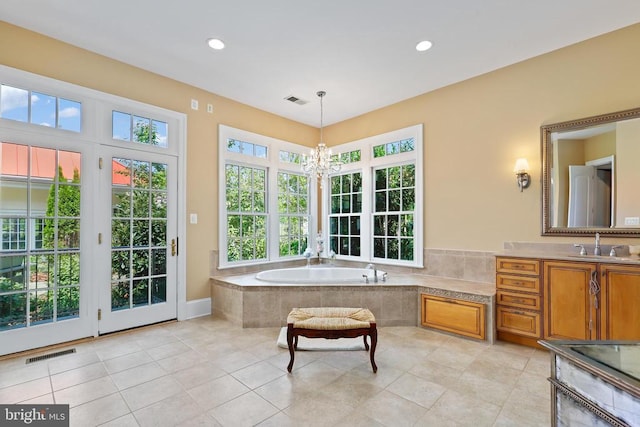 full bathroom featuring visible vents, recessed lighting, a bath, and a notable chandelier