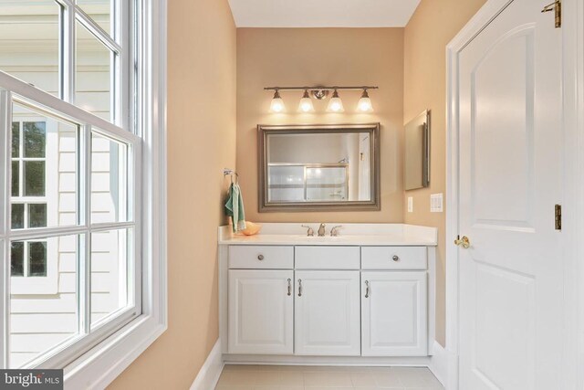 bathroom with vanity and walk in shower