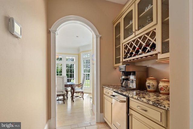 bar with arched walkways, a bar, and dishwasher