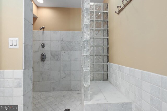 bathroom with tiled shower