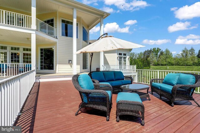 deck featuring outdoor lounge area