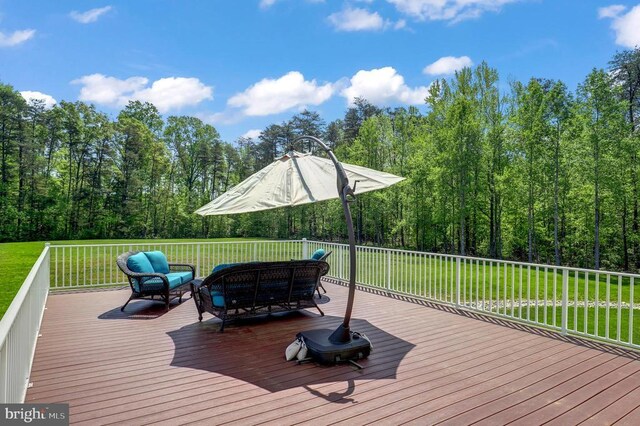 wooden terrace featuring an outdoor living space and a lawn