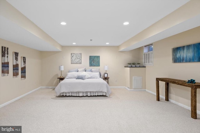 carpeted bedroom featuring baseboards and recessed lighting