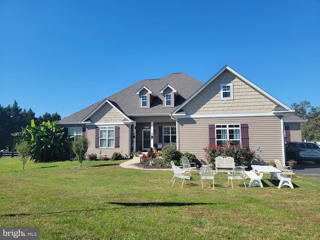 craftsman inspired home with a front lawn