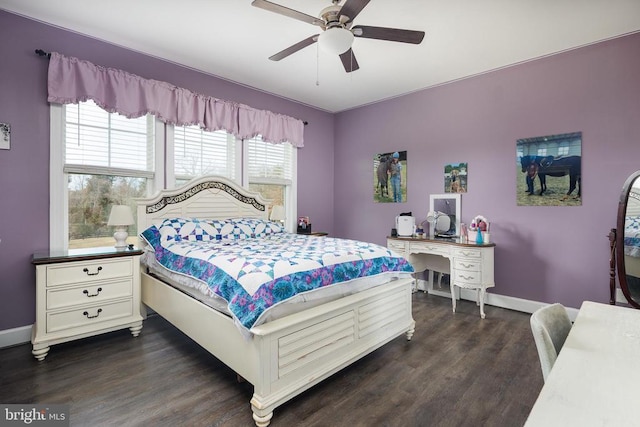 bedroom with dark wood-style floors, baseboards, and a ceiling fan