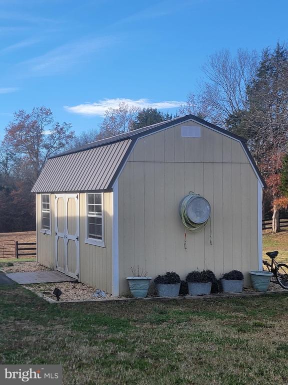 view of shed with fence