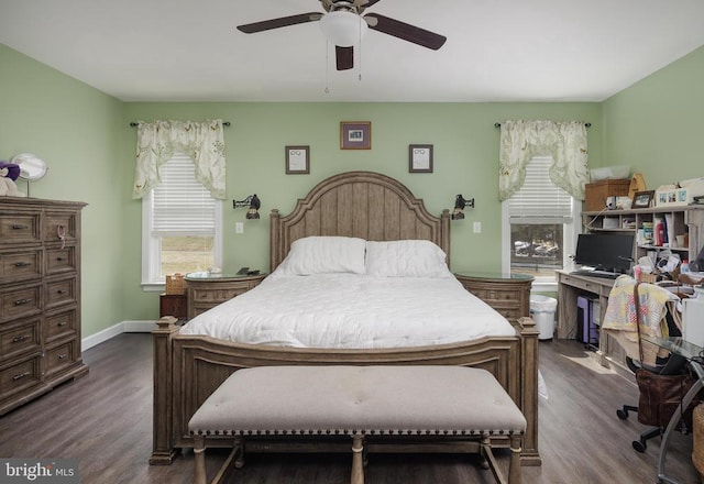 bedroom featuring dark wood-type flooring, baseboards, and a ceiling fan