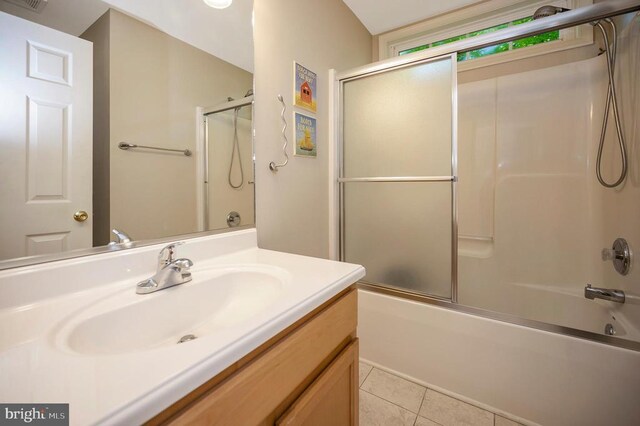 bathroom featuring shower / bath combination with glass door, tile patterned floors, visible vents, and vanity
