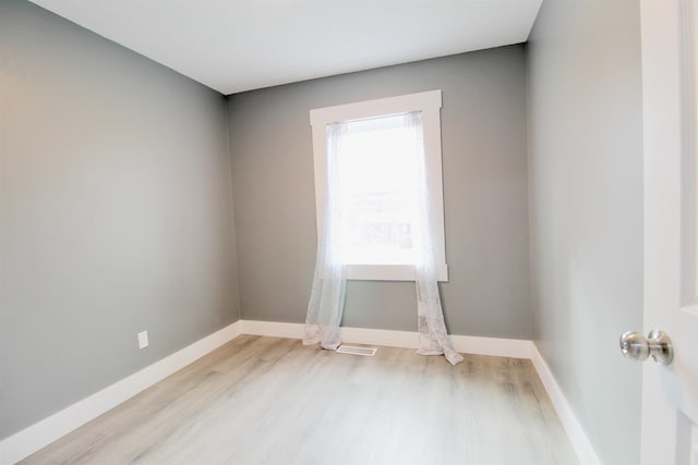 unfurnished room with light hardwood / wood-style floors