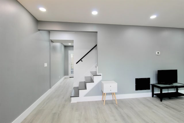 staircase featuring hardwood / wood-style floors