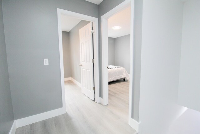 hallway with light wood-type flooring