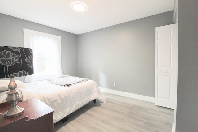 bedroom with light wood-type flooring