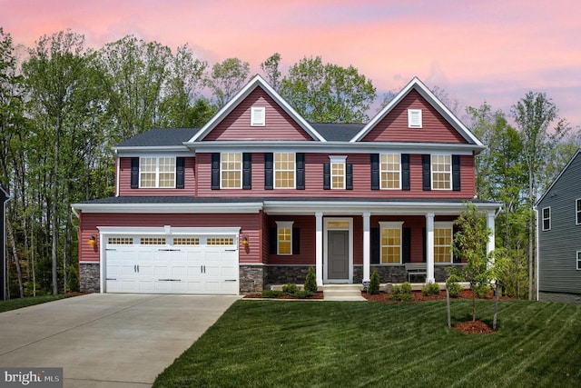 craftsman inspired home with a front lawn, driveway, stone siding, an attached garage, and a porch