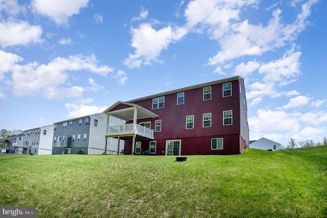 back of house with a lawn