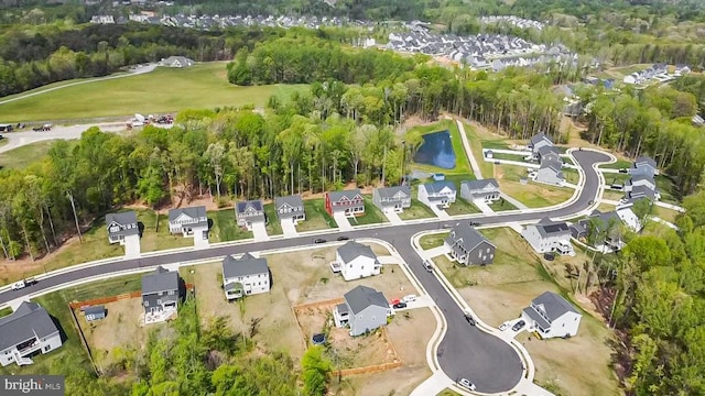 aerial view featuring a residential view and a water view