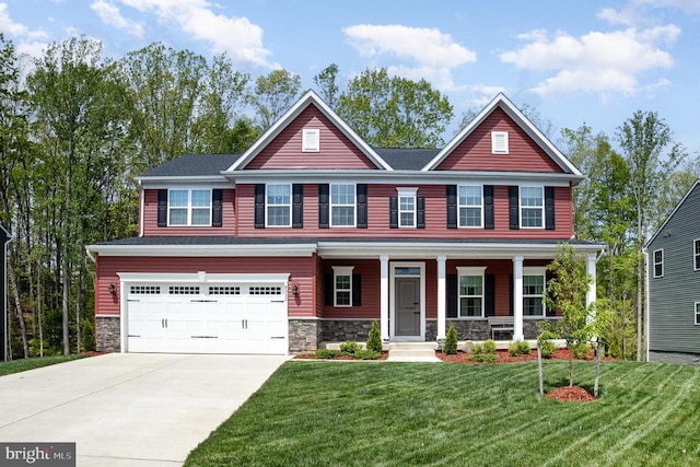 craftsman house with a front lawn, driveway, stone siding, a porch, and a garage