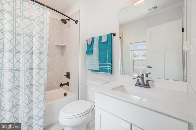 bathroom featuring shower / bath combo, visible vents, vanity, and toilet