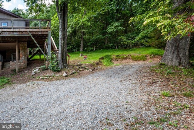 view of yard with a wooden deck