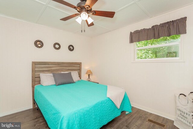 bedroom featuring ceiling fan and dark hardwood / wood-style floors