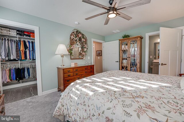 bedroom with a closet, ceiling fan, and carpet