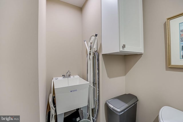 bathroom featuring sink and toilet