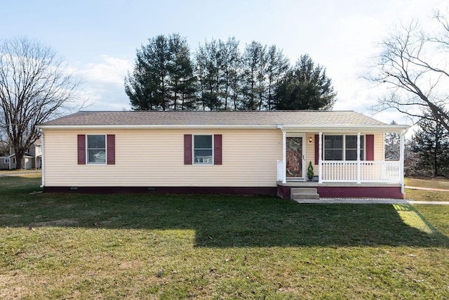 view of front facade with covered porch and a front lawn