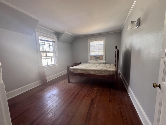 bedroom featuring crown molding and dark hardwood / wood-style floors