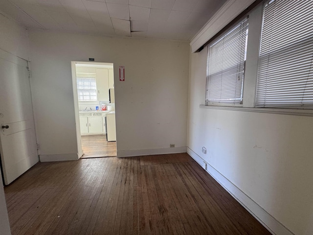 spare room with hardwood / wood-style flooring