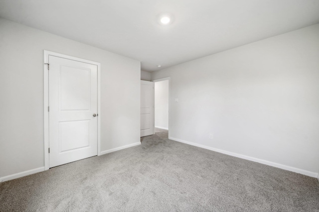 unfurnished bedroom with carpet flooring