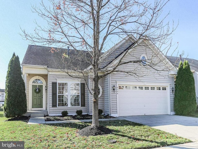 single story home featuring driveway and an attached garage