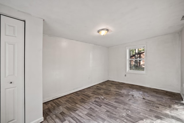 empty room featuring dark hardwood / wood-style floors