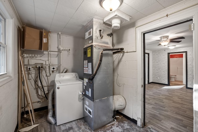 utilities featuring washer / clothes dryer and heating unit