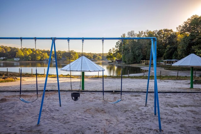 view of playground with a water view