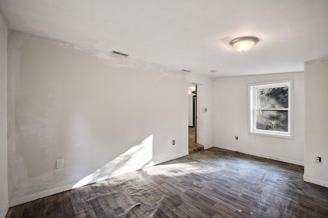 empty room featuring dark wood-type flooring