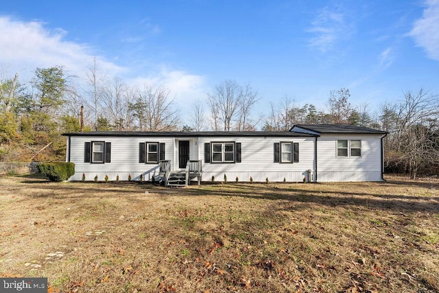 manufactured / mobile home with a front lawn