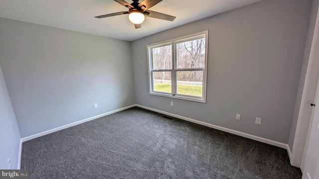 carpeted empty room with ceiling fan