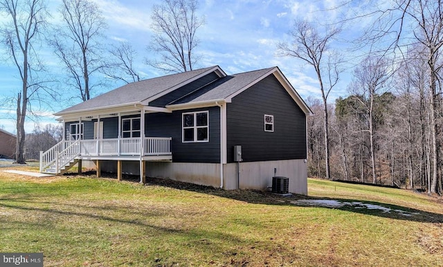 exterior space featuring a porch and a lawn