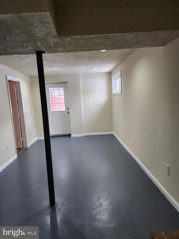 basement with a textured ceiling