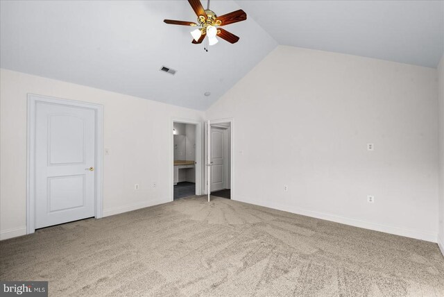 unfurnished bedroom with high vaulted ceiling, carpet flooring, visible vents, and baseboards