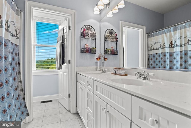 bathroom featuring a shower with curtain, vanity, and tile patterned flooring